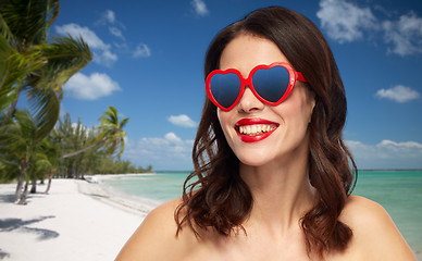 Image showing woman with red lipstick and heart shaped shades