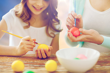 Image showing daughter and mother coloring easter eggs