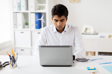 Image showing businessman with laptop working at office