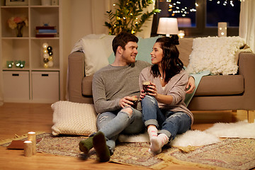 Image showing happy couple drinking coffee and eating at home