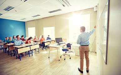 Image showing students and teacher at school white board