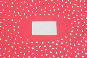 Image showing Blank card on pink background with shiny hearts