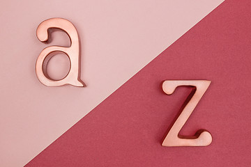 Image showing Metal letters on pink and cherry red background