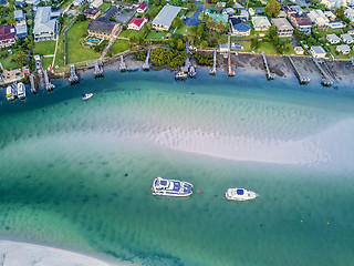 Image showing Boats in the shallow channel