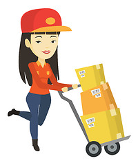 Image showing Delivery postman with cardboard boxes on trolley.