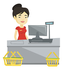 Image showing Cashier standing at the checkout in supermarket.