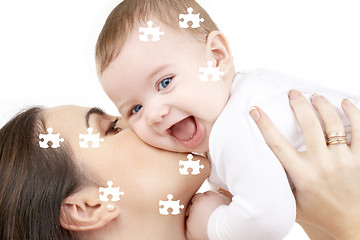 Image showing puzzle of laughing baby playing with mother