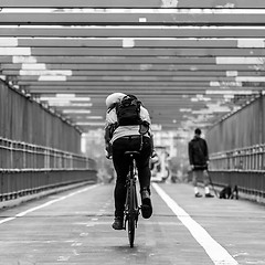 Image showing Man riding his bike in the cycling lane on Williamsburg Bridge, Brooklyn, New York City.