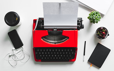 Image showing Workplace with bright red vintage typewriter