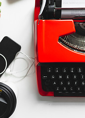 Image showing Workplace with bright red vintage typewriter