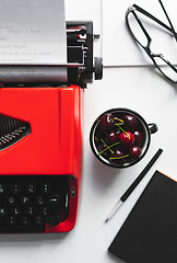 Image showing Workplace with bright red vintage typewriter