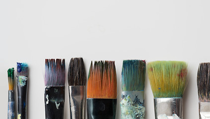 Image showing dirty paintbrushes from top