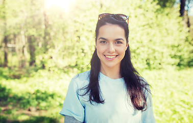Image showing happy young volunteer woman outdoors