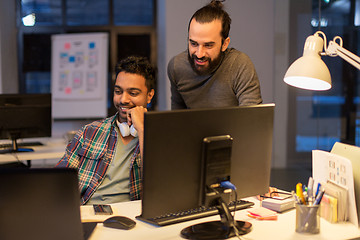 Image showing creative team with computer working late at office