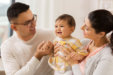 Image showing happy family with baby daughter at home