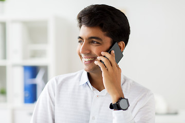 Image showing businessman calling on smartphone at office