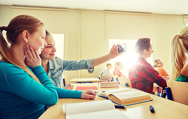 Image showing student girls taking smartphone selfie at school