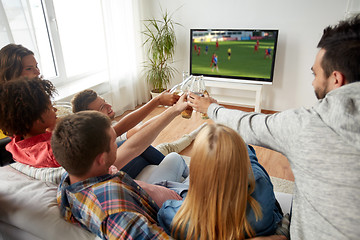 Image showing friends clinking beer and watching soccer game