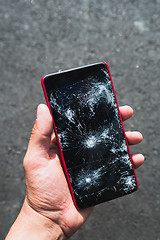 Image showing Person holding broken smartphone