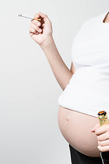 Image showing Pregnant woman with beer and cigarette