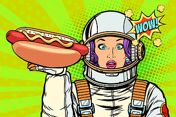 Image showing Hungry woman astronaut with hot dog sausage
