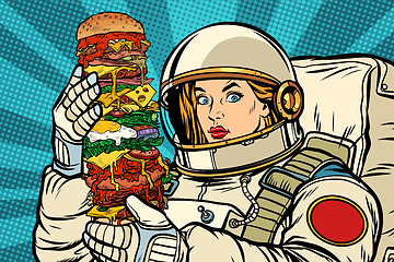 Image showing Hungry woman astronaut with giant Burger