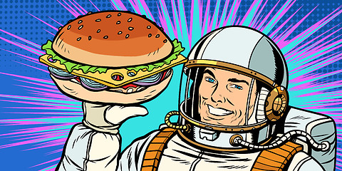 Image showing Smiling male astronaut presents Burger