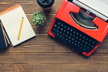 Image showing Vintage typewriter on wooden background