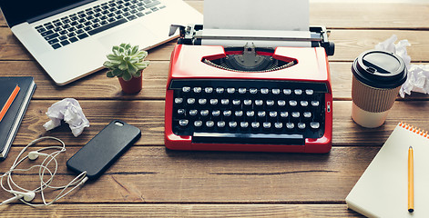 Image showing Vintage typewriter on wooden background