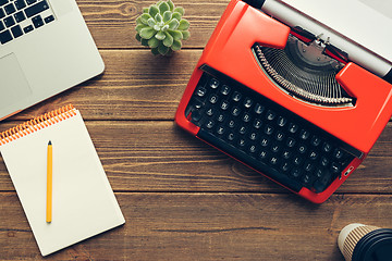 Image showing Vintage typewriter on wooden background