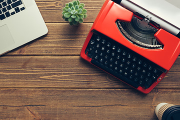 Image showing Vintage typewriter on wooden background