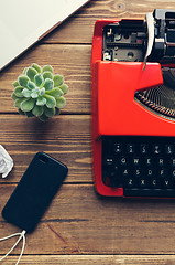 Image showing Vintage typewriter on wooden background