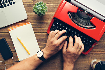 Image showing Top view of man using typewriter