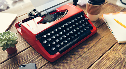 Image showing Vintage typewriter on wooden background