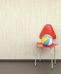 Image showing red chair at a wall with a ball