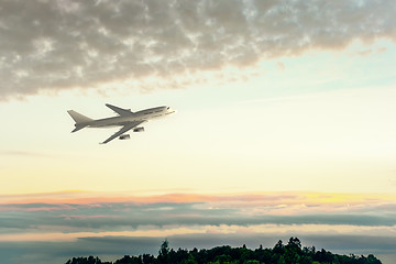 Image showing an Airplane and the sunset sky