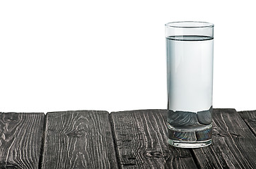Image showing Single glass of water on wooden table