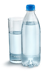 Image showing Glass with water and a plastic bottle