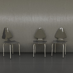 Image showing three black chairs at a wall with space for your content