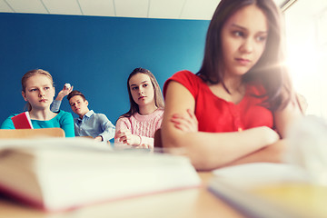 Image showing students gossiping behind classmate back at school