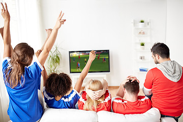 Image showing friends or soccer fans watching game on tv at home