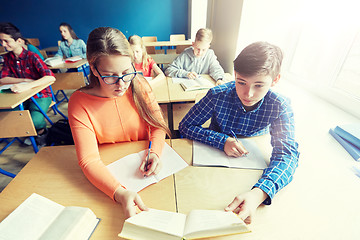 Image showing students reading book at school lesson