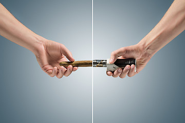 Image showing Hand holding an electronic cigarette