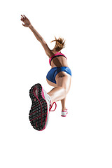 Image showing The studio shot of high jump female athlete is in action