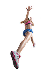 Image showing The studio shot of high jump female athlete is in action