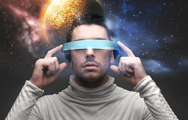 Image showing man in 3d glasses over space background