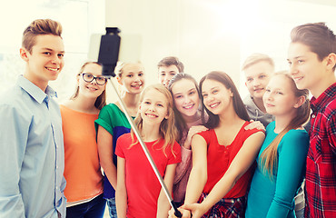 Image showing group of students taking selfie with smartphone