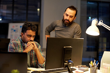 Image showing creative team with computer working late at office