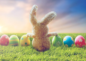 Image showing close up of colored easter eggs and toy bunny