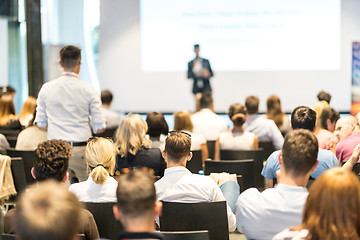 Image showing Business speaker giving a talk at business conference event.